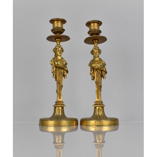 97 - A Pair of French Gilt Bronze Candlesticks, The Supports having Drip Trays Surmounting Classical Maid... 