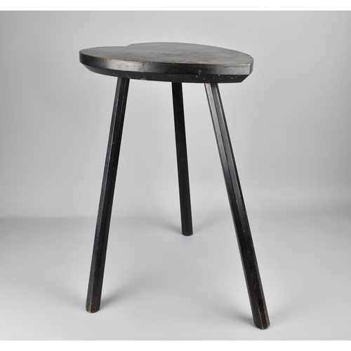 60 - An Ebonised Three Legged Heart Shaped Stool