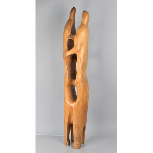 63 - A Carved Wooden Modern Art Sculpture depicting Couple Embracing, 93cms High