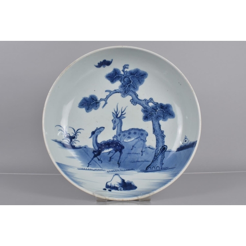 355 - A 19th Century Chinese Blue and White Shallow Dish Decorated with Deer beside Water and Tree, 29cms ... 