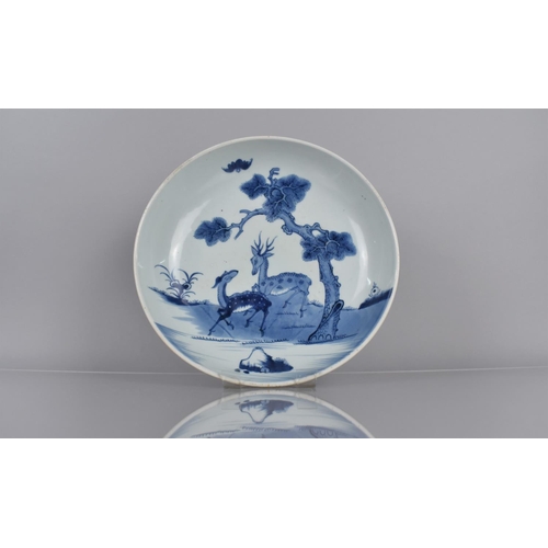 355 - A 19th Century Chinese Blue and White Shallow Dish Decorated with Deer beside Water and Tree, 29cms ... 