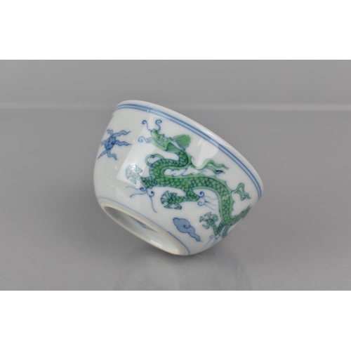 340 - A Chinese Porcelain Doucai Cup/Tea Bowl, Decorated with Dragons Chasing Flaming Pearl, Six Character... 