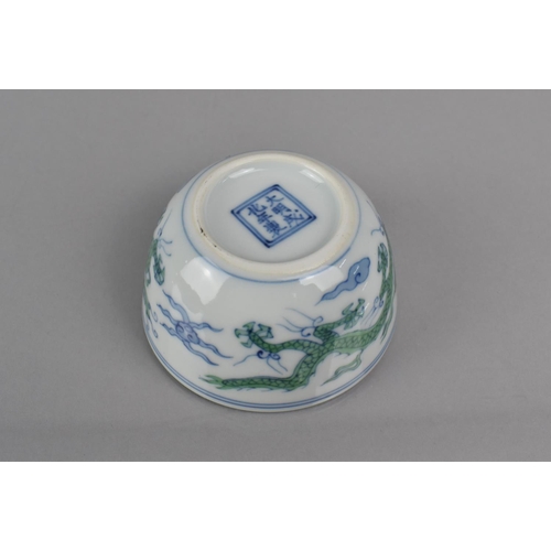 340 - A Chinese Porcelain Doucai Cup/Tea Bowl, Decorated with Dragons Chasing Flaming Pearl, Six Character... 