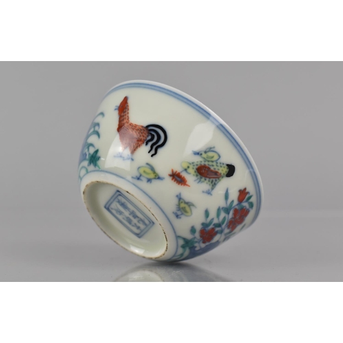 339 - A Chinese Porcelain Doucai Chicken Cup in the Ming Style (1368-1644), Six Character Mark to Base for... 