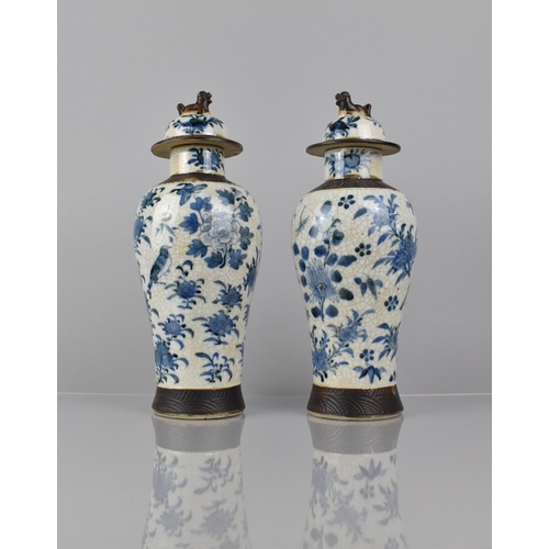 346 - A Pair of Chinese Blue and white Crackle Glazed Baluster Vases and Covers Decorated in Flower. Butte... 