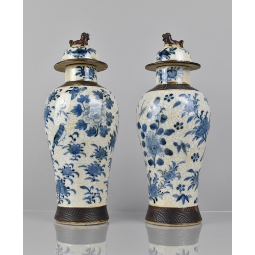 346 - A Pair of Chinese Blue and white Crackle Glazed Baluster Vases and Covers Decorated in Flower. Butte... 