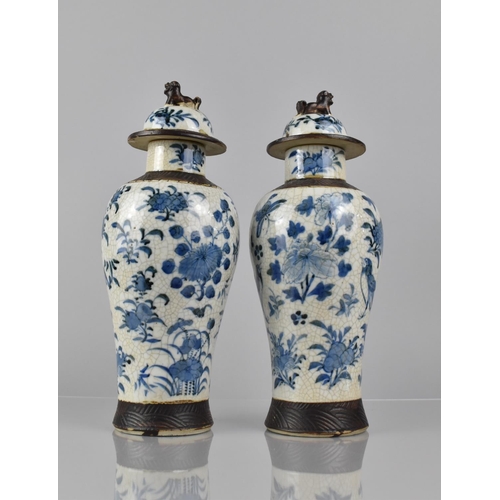 346 - A Pair of Chinese Blue and white Crackle Glazed Baluster Vases and Covers Decorated in Flower. Butte... 