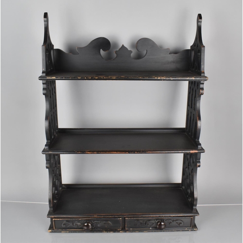 125 - A Set of Ebonised Mahogany Three Tier Wall Shelves with Two Drawers and Decorative Pierced Ends, 19x... 