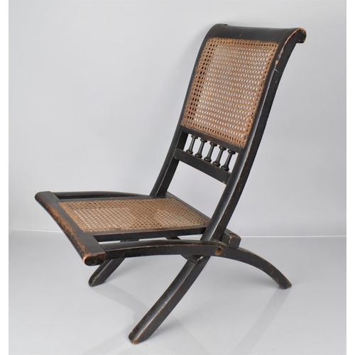 413 - A 19th Century Ebonised Wooden Folding Chair and Back, 60cms High