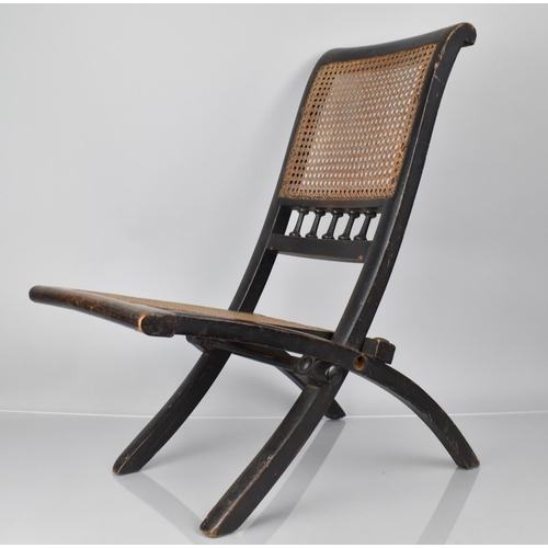 413 - A 19th Century Ebonised Wooden Folding Chair and Back, 60cms High