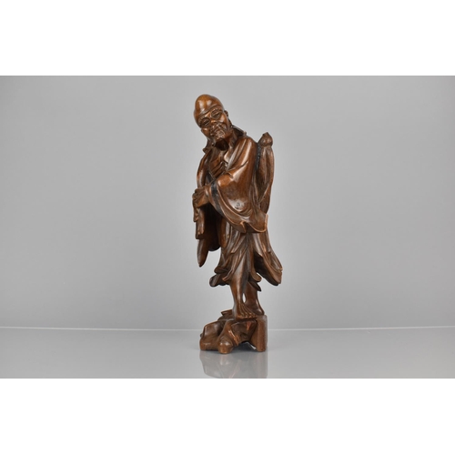 383 - A 19th Century Chinese Carved Hardwood Figure of Shouxing Chinese God of Longevity, 31cms High