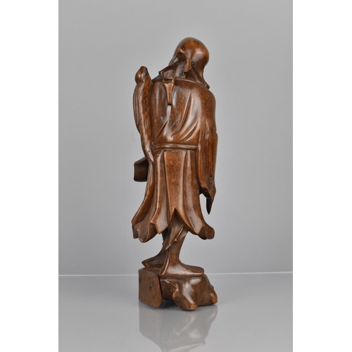 383 - A 19th Century Chinese Carved Hardwood Figure of Shouxing Chinese God of Longevity, 31cms High