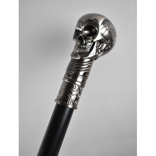 111 - A Reproduction Ebonized Walking Cane with Novelty Skull Handle