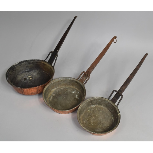 114 - A Collection of Three North African Copper Saucepans with Metal Handles