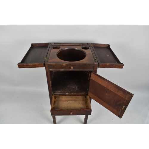 58 - A George III Mahogany Gentlemans Wash Stand with a Opening Two Part Lid Revealing a Rise and Fall To... 