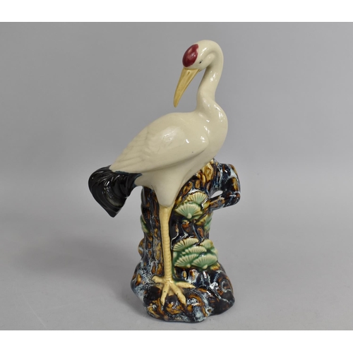 255 - A Chinese Glazed Ceramic Spill Vase in the Form of Red Crown Crane Beside Tree Trunk, 25cm high