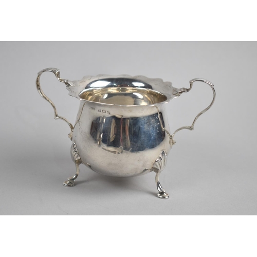 370 - An Edwardian Silver Two handled Sugar Bowl on Three Scrolled Feet, Birmingham 1907, 9cm high