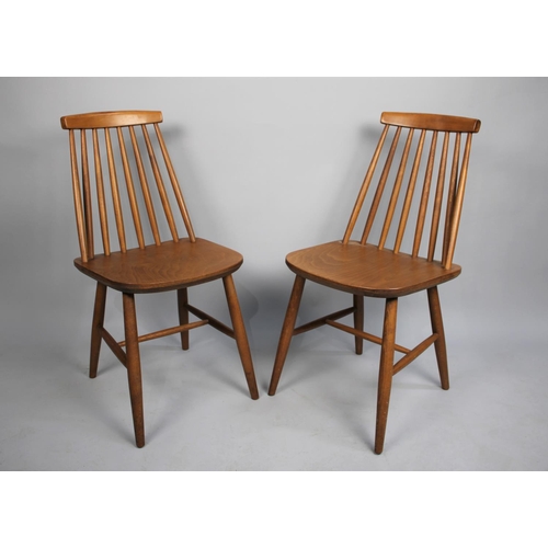 452 - A Set of Eight Mid 20th Century Spindle Back Dining Chairs in the Ercol Style