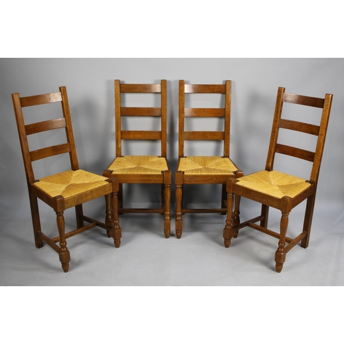 477 - A Set of Four Modern Rush Seated Oak Ladder Back Dining Chairs