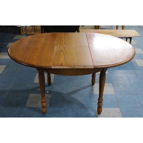 478 - A Modern Oak Extending Oval Dining Table, 148x108cms Max