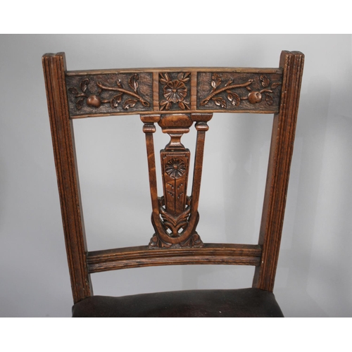 482 - A Pair of Edwardian Carved Oak Frame Side Chairs with Hide Seats