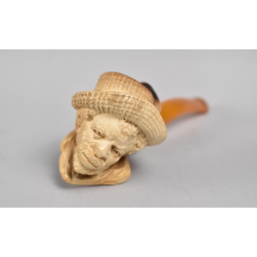 70 - A Carved Meerschaum Pipe with Amber Mouthpiece, Bowl in the Form of Bearded African Gent with Feathe... 