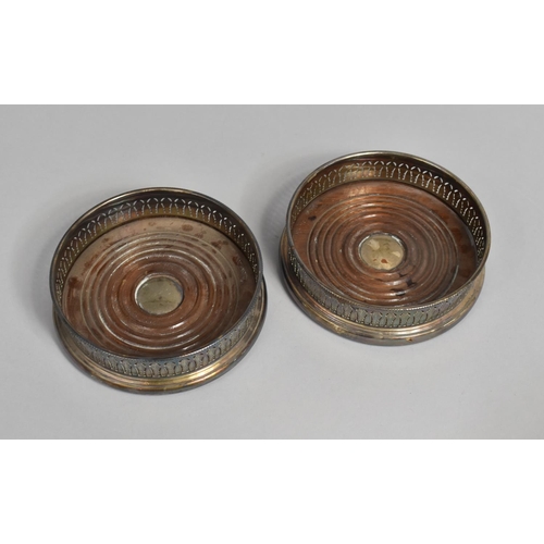 91 - A Pair of Mid 20th Century Silver Plated Bottle Coasters with Pierced Decoration, 13cms Diameter