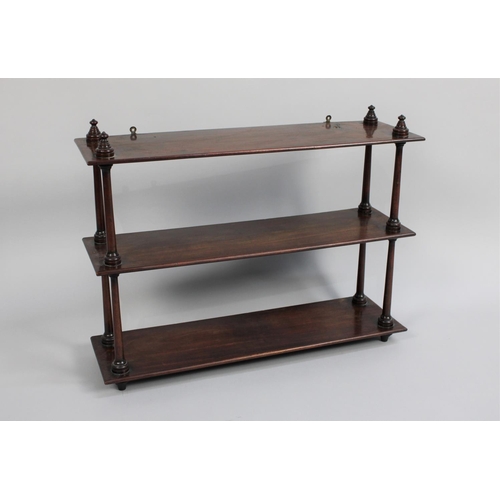 449 - A Late Victorian Mahogany Wall Hanging Three Tier Shelf Unit with Turned Supports, 62cms Wide