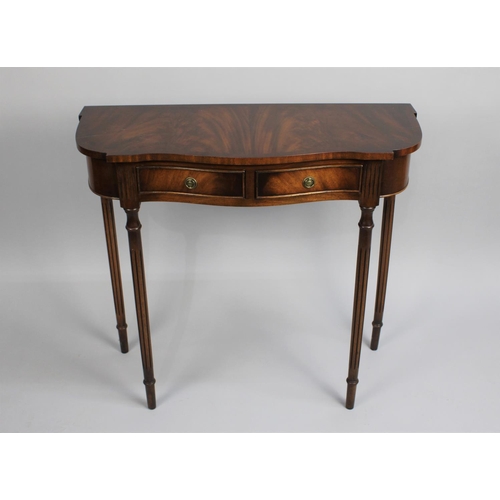 453 - A Reprodux Mahogany Serpentine Front Side Table with Two Small Drawers on Turned Reeded Supports, 80... 