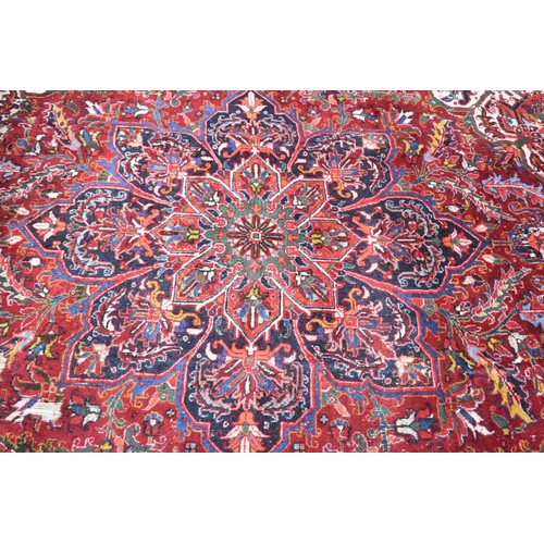 456 - A Large Antique Persian Heriz Rug on Red Ground, Some Wear and Condition Issues, 340x240cms