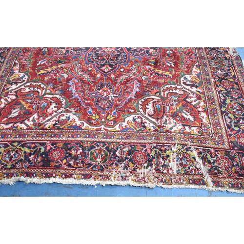 456 - A Large Antique Persian Heriz Rug on Red Ground, Some Wear and Condition Issues, 340x240cms