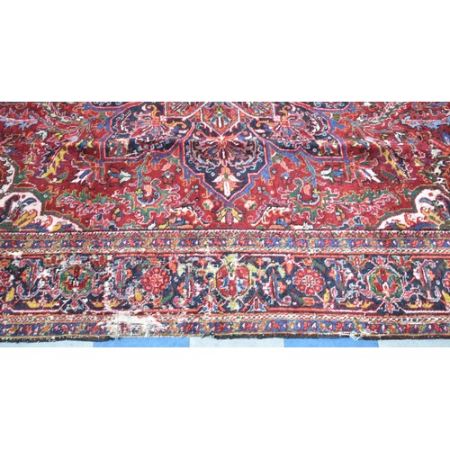 456 - A Large Antique Persian Heriz Rug on Red Ground, Some Wear and Condition Issues, 340x240cms