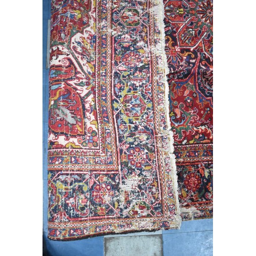 456 - A Large Antique Persian Heriz Rug on Red Ground, Some Wear and Condition Issues, 340x240cms