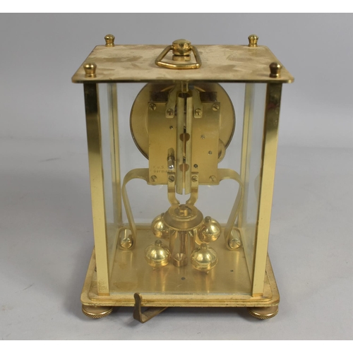 54 - A Mid 20th Century Brass and Four Glass Pillar Clock, German Movement, 16cms High