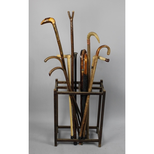 262 - A Vintage Eight Division Stick Stand Containing Large Quantity of Walking Sticks and Umbrella to Inc... 