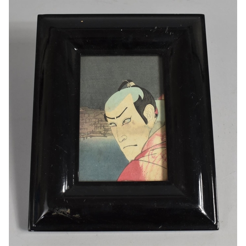 141 - A Reproduction Ebonized Photo Frame Containing Section of Chinese Actor Print, 24x19cms