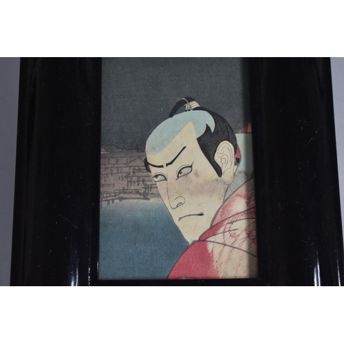 141 - A Reproduction Ebonized Photo Frame Containing Section of Chinese Actor Print, 24x19cms