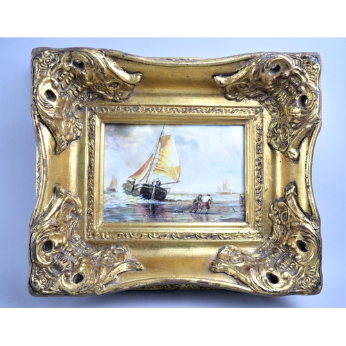 144 - A Reproduction Gilt Framed Print of Barges Unloading at Beach, 17x11cms