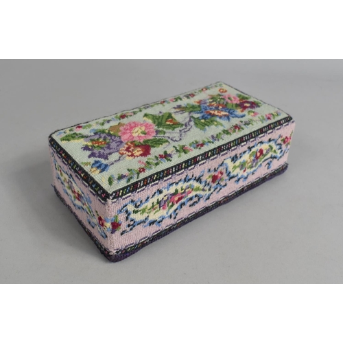 170 - A Novelty Doorstop in the Form of A Tapestry Covered Brick