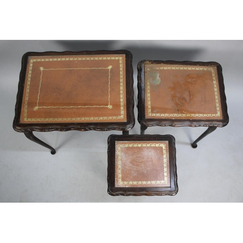 230 - A Mid 20th Century Nest of Three Mahogany Framed Tables with Tooled Leather Tops, 54cms Wide