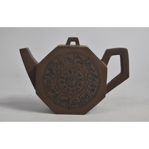 246 - A Chinese Yixing Teapot of Flattened Octagonal Form Decorated with the Zodiac, 10cm high