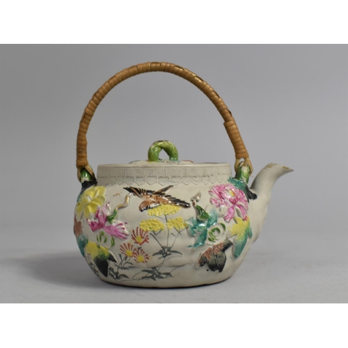 248 - A Yixing Teapot Decorated in Shallow Relief with Multicoloured Enamels Depicting Birds and Flower