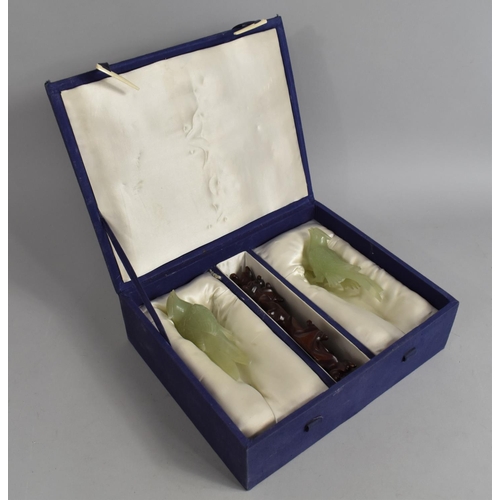 252 - A Cased Chinese Boxed Pair of Jade Effect Birds on Wooden Stands, Both with Condition Issues