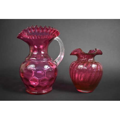 418 - Two Pieces of Cranberry Glass, Large Jug 25.5cms High and Vase 18cms High