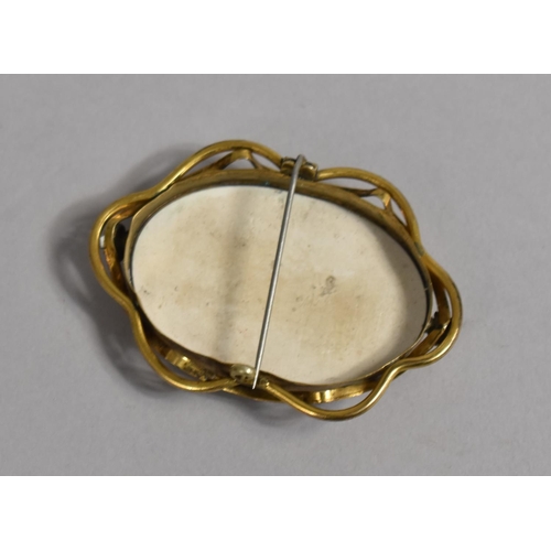 437 - A Hand Painted Porcelain Oval of a Maiden, Mounted in Gold Plated Brooch Surround, 6.25cms Long