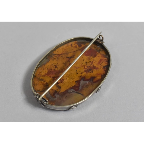 438 - A Polished Oval Agate Brooch, 5.5cms Long