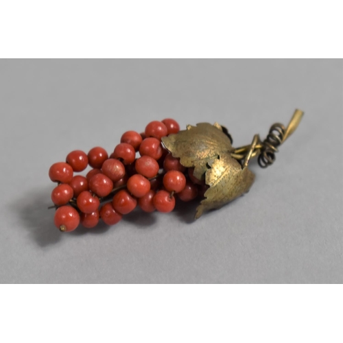 439 - A Continental Silver Gilt and Red Coral Brooch the form of a Bunch of Grapes, Stamped 800