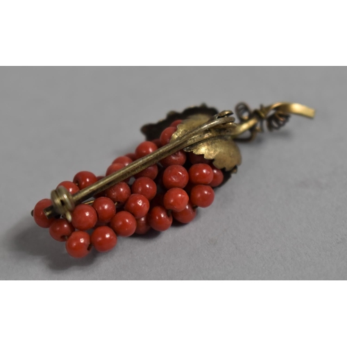 439 - A Continental Silver Gilt and Red Coral Brooch the form of a Bunch of Grapes, Stamped 800