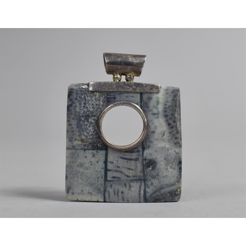 445 - A Silver Mounted Square Polished Stone Pendant