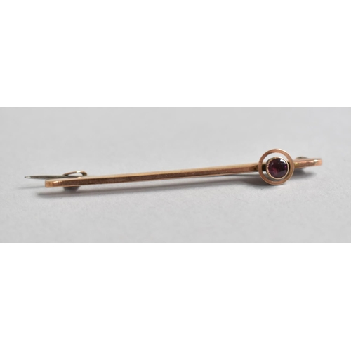 452 - A 9ct Gold Bar Brooch with Garnet Mount